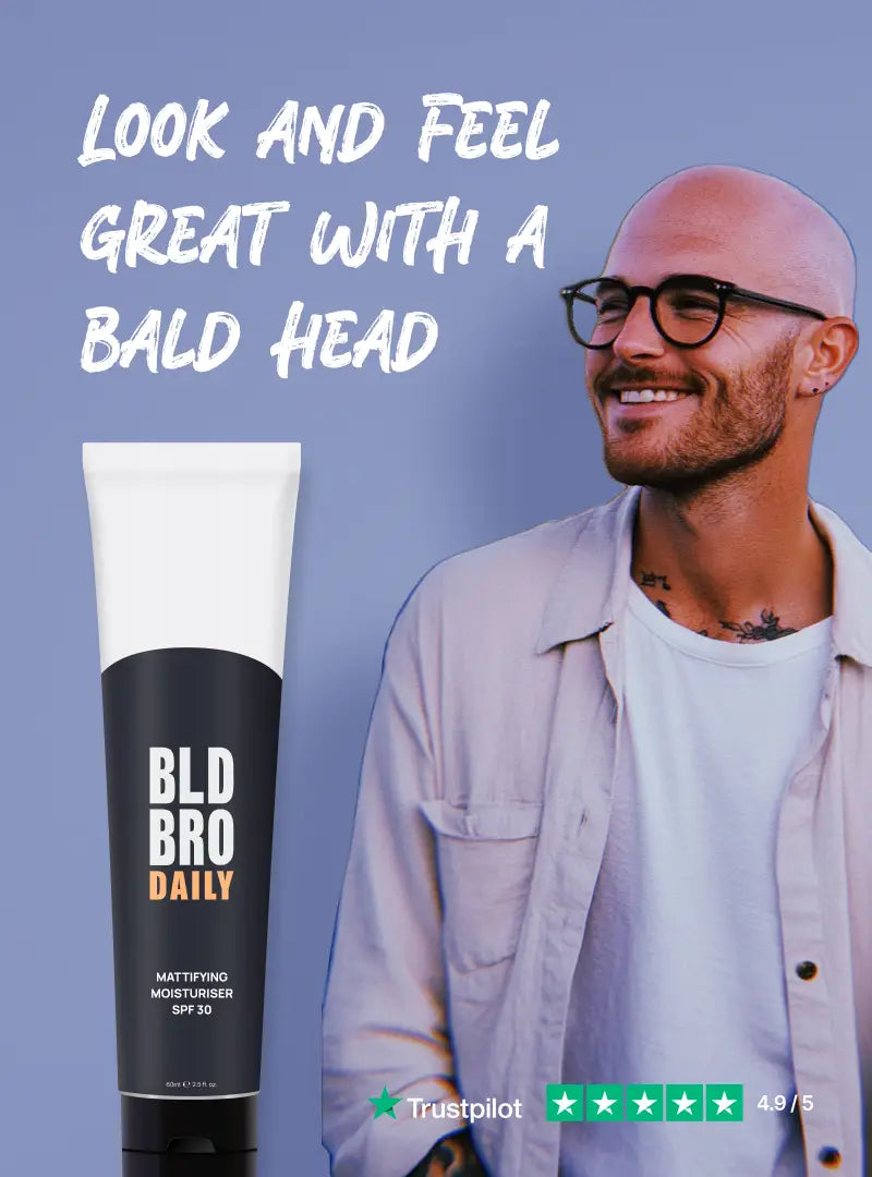 The BLD BRO Daily 30 bottle next to a happy bald man looking towards text that reads look and feel great with a bald head.