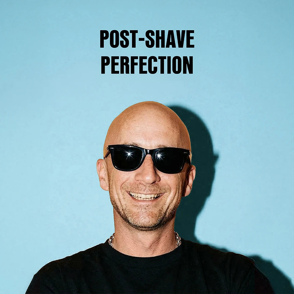 A smiling bald man wearing black sunglasses and a black shirt against a light blue background, with the text 'POST-SHAVE PERFECTION' above him.