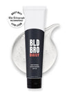 Tube of BLD BRO DAILY mattifying Moisturiser SPF 50 with product smear on white background
