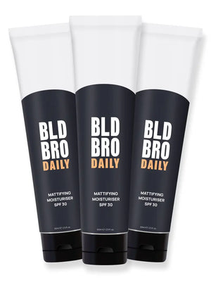 Three tubes of BLD BRO DAILY mattifying moisturizer on a white background