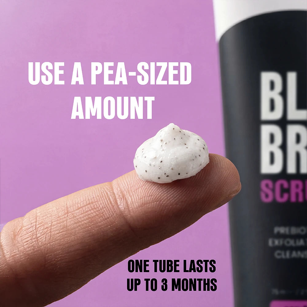 A close-up of a finger holding a pea-sized dollop of white exfoliating scrub with small dark specks, next to a black tube labeled BLD BRO, on a purple background with text reading 'USE A PEA-SIZED AMOUNT' and 'ONE TUBE LASTS UP TO 3 MONTHS'.